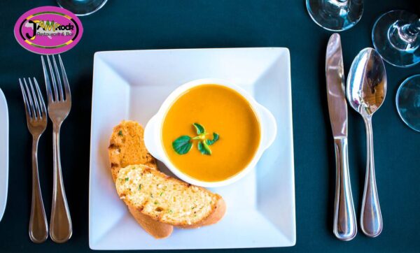 Island Spiced Pumpkin Soup Served with Garlic Bread